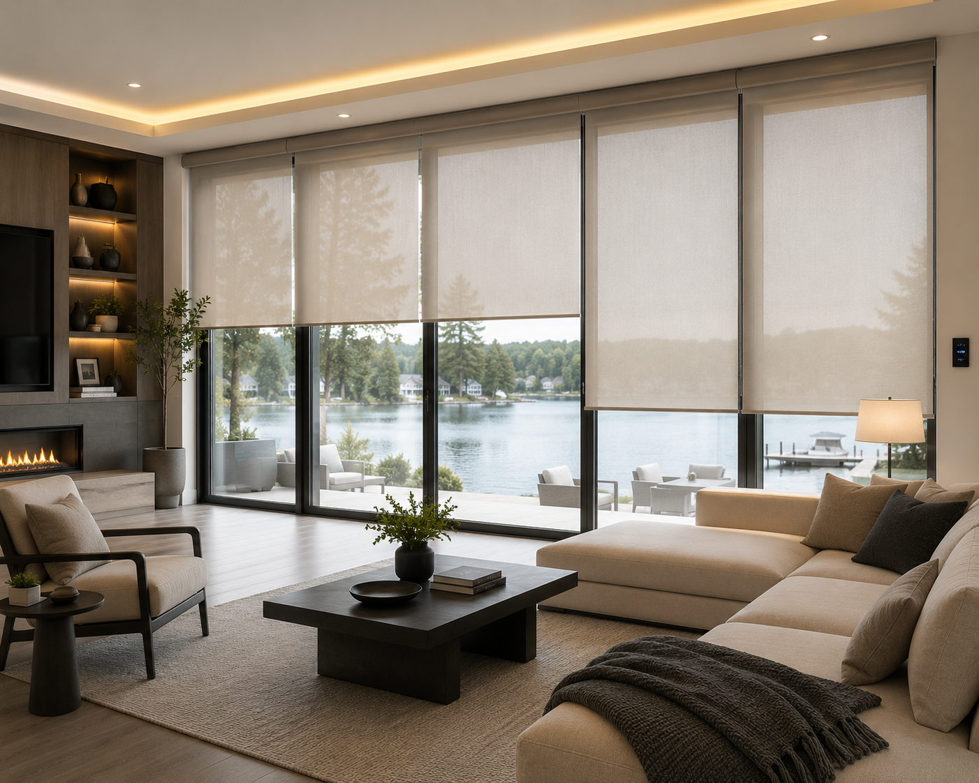 Modern lakeside living room with motorized shades installed on floor-to-ceiling windows